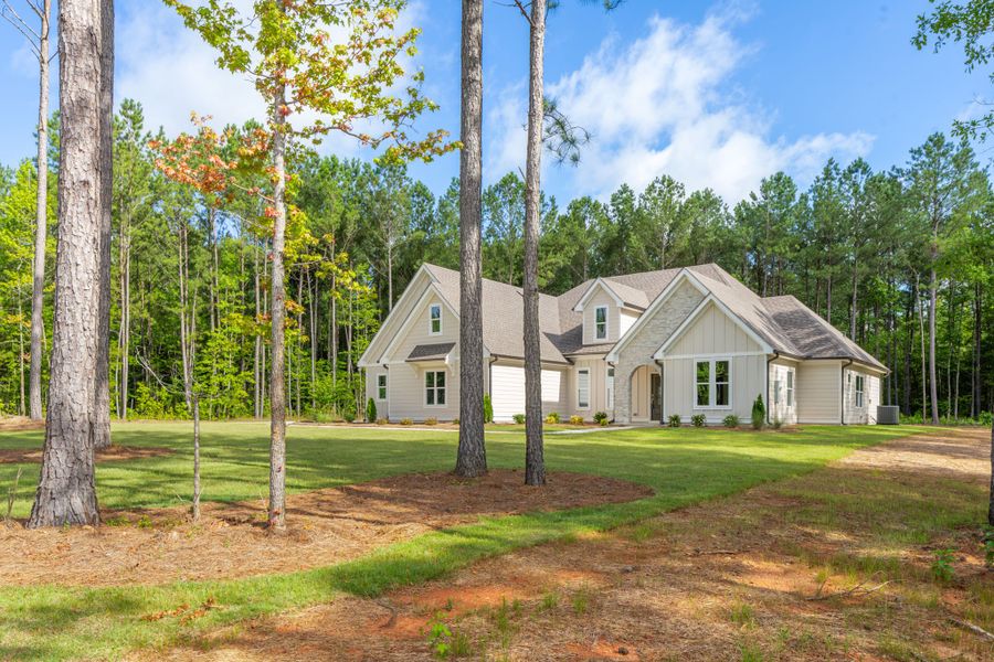 Front exterior of a new home in Flint Farms, Concord, GA, highlighting curb appeal (Image 2).