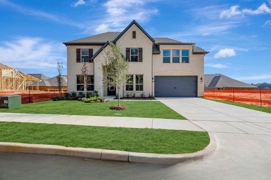 Front exterior of a new home in Sterling Greene, Arlington, TX, highlighting curb appeal (Image 1). Front exterior of a new home in Sterling Greene, Arlington, TX, highlighting curb appeal (Image 1).