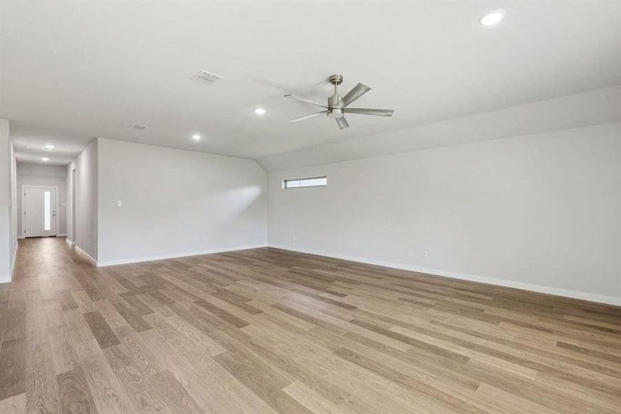 Living and Dining Rooms in the Oscar home plan by Trophy Signature Homes – REPRESENTATIVE PHOTO