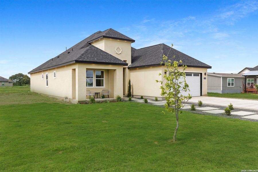 Front exterior of a new home in , Atascosa, TX, highlighting curb appeal (Image 28).
