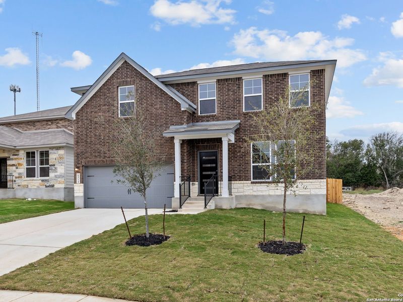 Front exterior of a new home in Royal Crest, San Antonio, TX, highlighting curb appeal (Image 18).