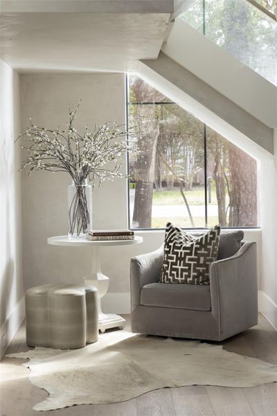 Beneath the stairs, a cozy nook provides the perfect retreat for afternoon reading. Beneath the stairs, a cozy nook provides the perfect retreat for afternoon reading.