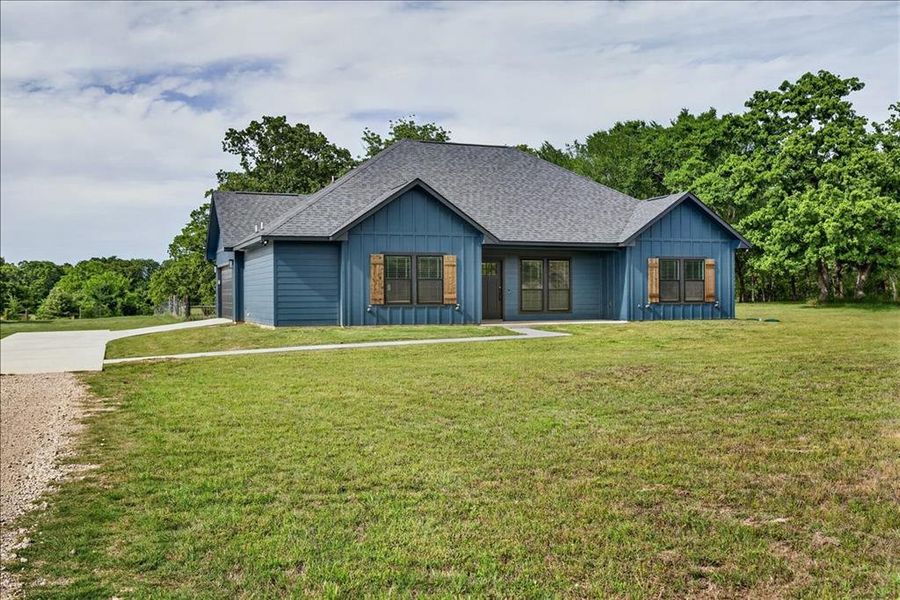 Front exterior of a new home in , Athens, TX, highlighting curb appeal (Image 20).