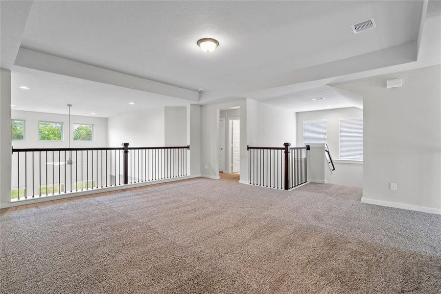 Gorgeous view from Game room into Family Room and all the natural light coming in.