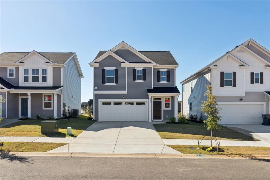 Front exterior of a new home in Windsor, North Augusta, SC, highlighting curb appeal (Image 1). Front exterior of a new home in Windsor, North Augusta, SC, highlighting curb appeal (Image 1).