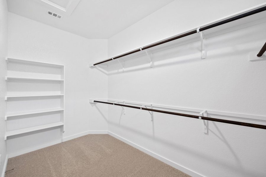 Primary Closet in the Oak home plan by Trophy Signature Homes – REPRESENTATIVE PHOTO Primary Closet in the Oak home plan by Trophy Signature Homes – REPRESENTATIVE PHOTO