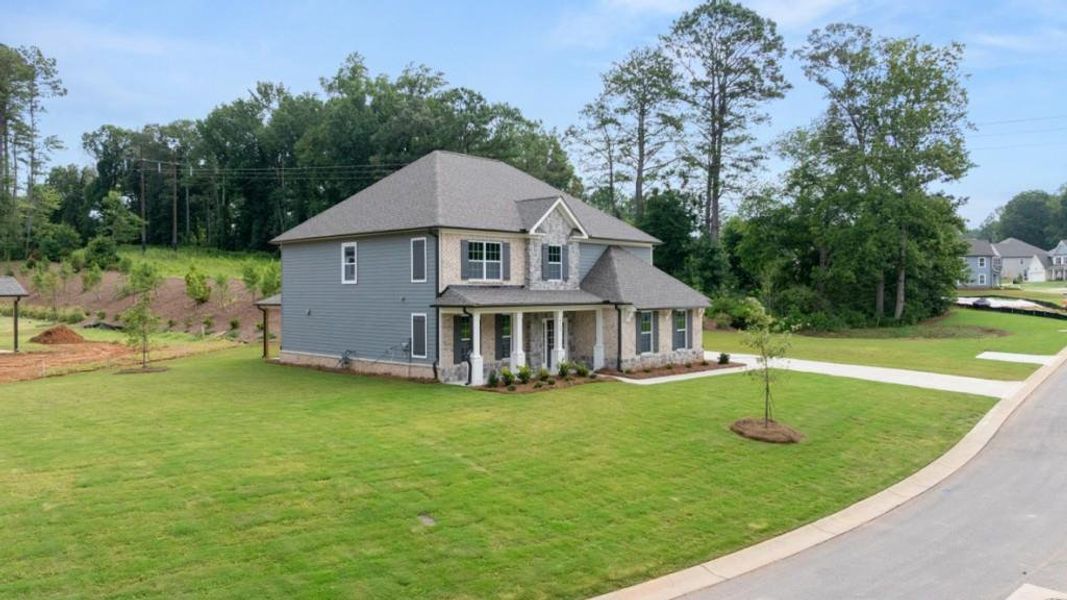 Front exterior of a new home in Haven Abbey, Cumming, GA, highlighting curb appeal (Image 2). Front exterior of a new home in Haven Abbey, Cumming, GA, highlighting curb appeal (Image 2).