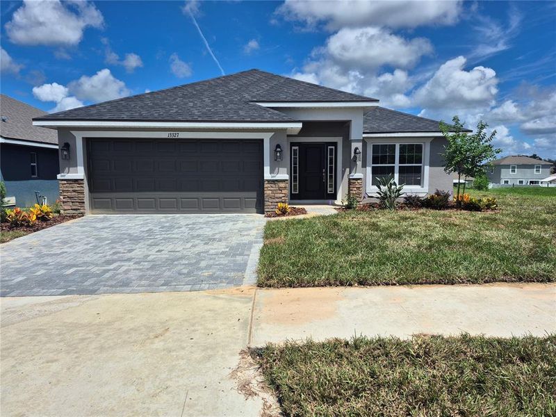 Front exterior of a new home in Abbey Glen, Dade City, FL, highlighting curb appeal (Image 1).