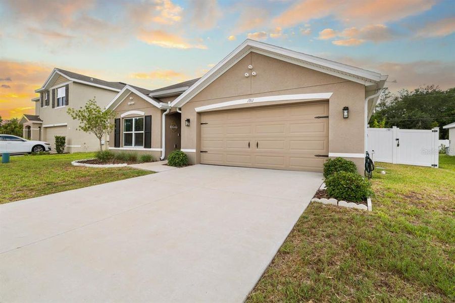 Front exterior of a new home in Brookside, Ruskin, FL, highlighting curb appeal (Image 25).