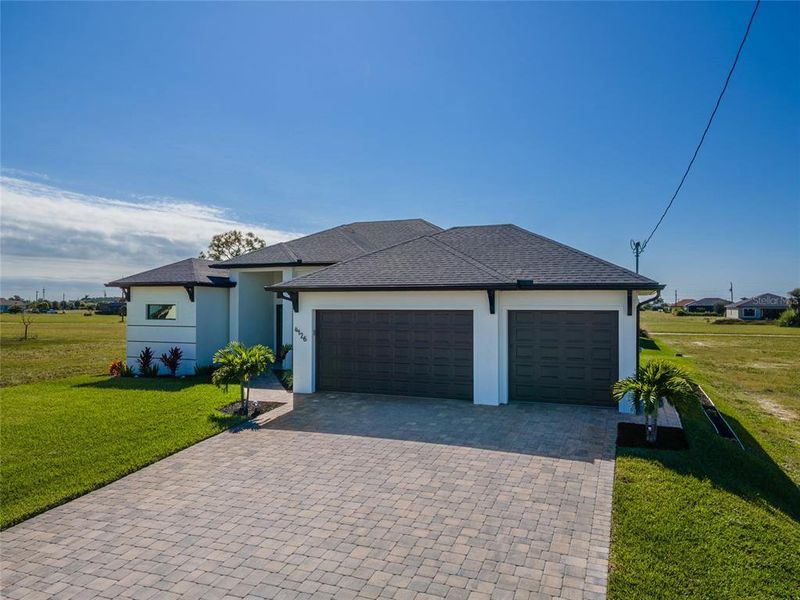 Front exterior of a new home in , Cape Coral, FL, highlighting curb appeal (Image 31). Front exterior of a new home in , Cape Coral, FL, highlighting curb appeal (Image 31).