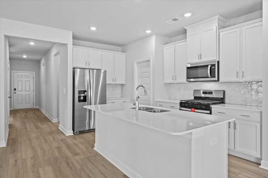 Furnished interior view inside a new home in The Farm at Wells Creek - Signature Collection, Gray Court (Image 6).