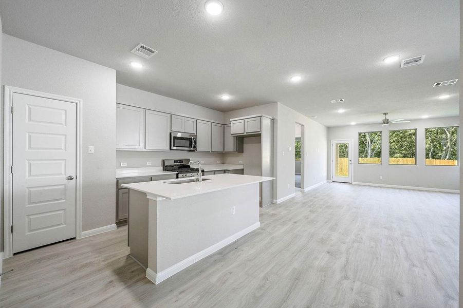 Kitchen in the Willow home plan by Trophy Signature Homes – REPRESENTATIVE PHOTO