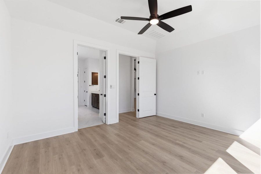 Primary Bedroom with elevated ceiling
