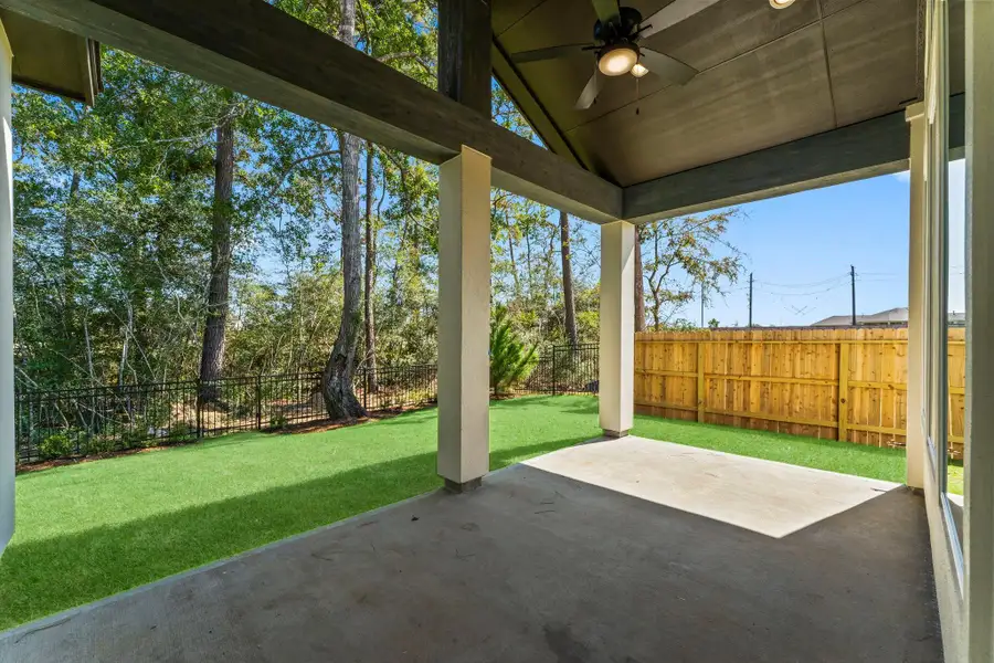 Rear covered patio with Woodland View