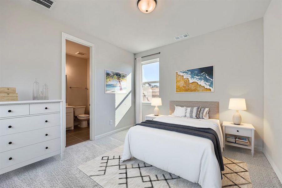 VIRTUALLY STAGED PHOTO -Bedroom featuring connected bathroom and light colored carpet