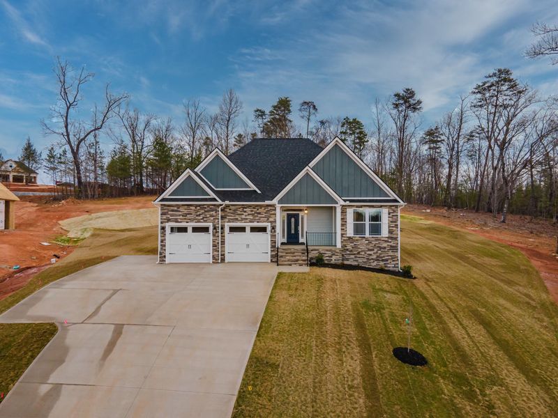 Representative exterior photo of a completed home built from the Roosevelt Elite by Enchanted Homes in Pointe Summit, Slater-Marietta, SC (Image 24).