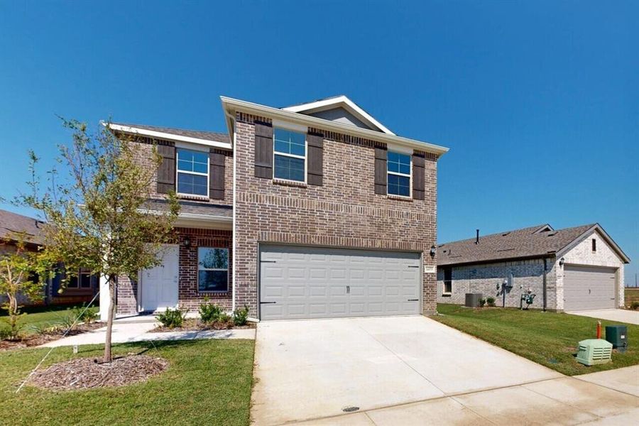 Front exterior of a new home in Mobberly Farms, Pilot Point, TX, highlighting curb appeal (Image 19).