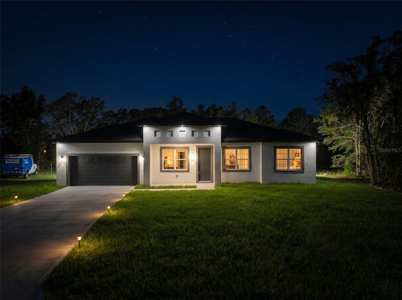 Front exterior of a new home in , Ocala, FL, highlighting curb appeal (Image 2). Front exterior of a new home in , Ocala, FL, highlighting curb appeal (Image 2).