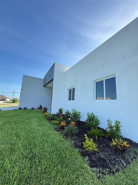 Front exterior of a new home in , Cape Coral, FL, highlighting curb appeal (Image 2).
