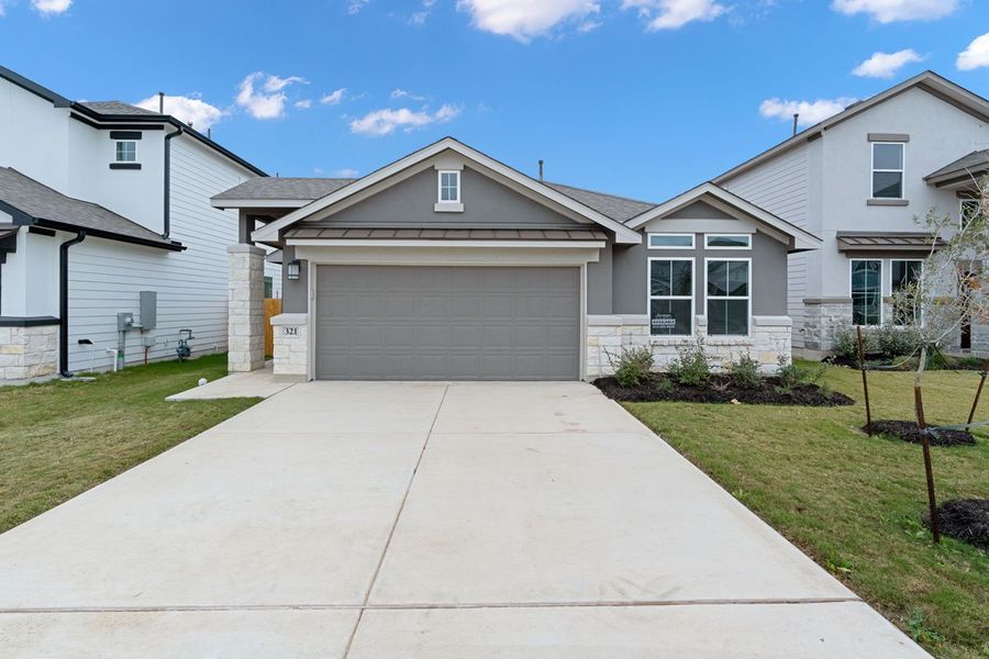 Representative exterior photo of a completed home built from the Mia by Saratoga Homes in Enclave at Dobbin, Magnolia, TX (Image 5). Representative exterior photo of a completed home built from the Mia by Saratoga Homes in Enclave at Dobbin, Magnolia, TX (Image 5).
