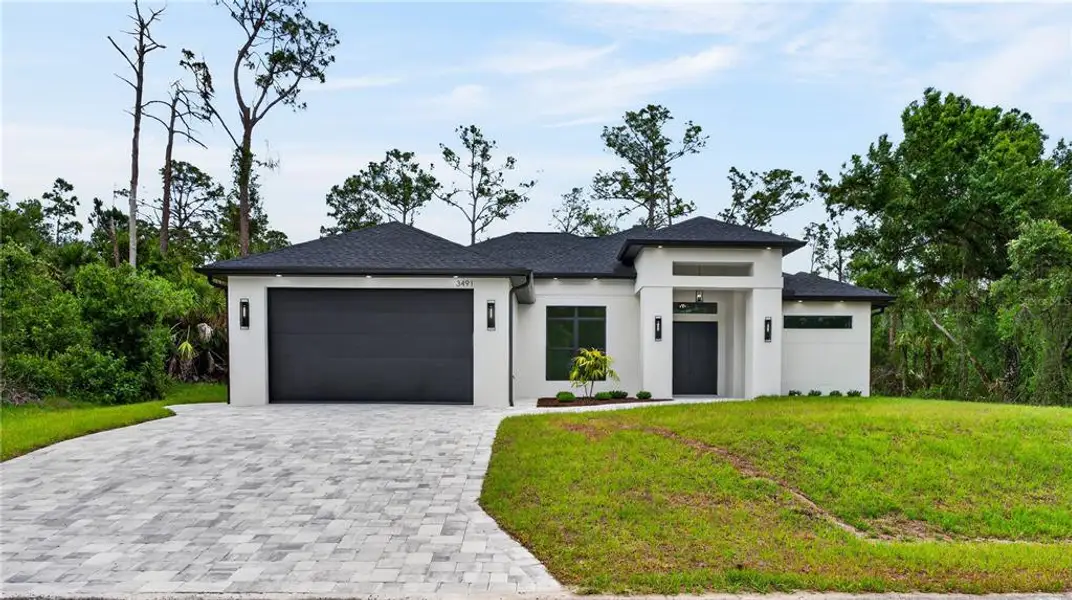 Front exterior of a new home in , North Port, FL, highlighting curb appeal (Image 32).