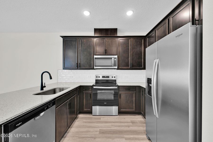 Furnished interior view inside a new home in Baxley Villas, Middleburg (Image 4).