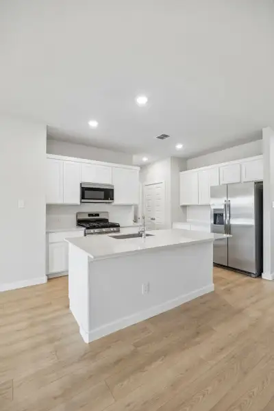 Kitchen in the Mesquite home plan by Trophy Signature Homes – REPRESENTATIVE PHOTO Kitchen in the Mesquite home plan by Trophy Signature Homes – REPRESENTATIVE PHOTO