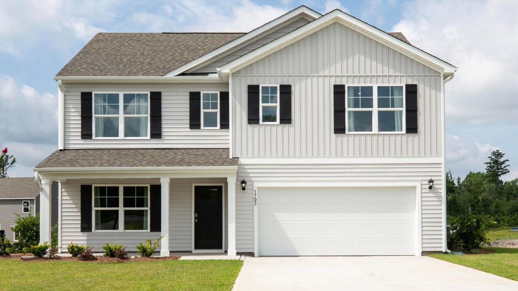 Front exterior of a new home in Bella Point, Bolivia, NC, highlighting curb appeal (Image 1).
