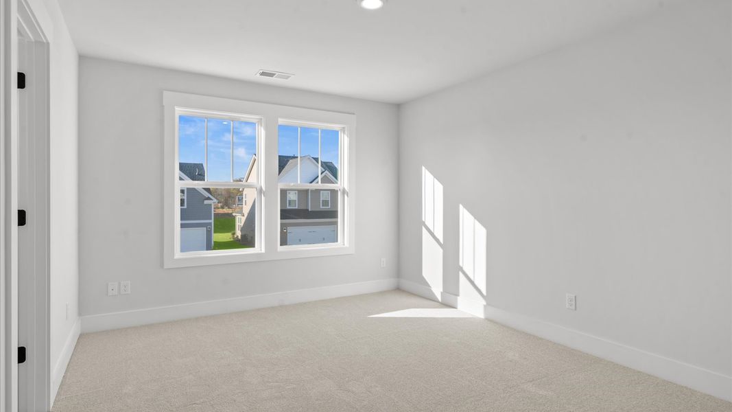 Refined bedroom design with large windows for daylight-filled mornings and peaceful views Refined bedroom design with large windows for daylight-filled mornings and peaceful views