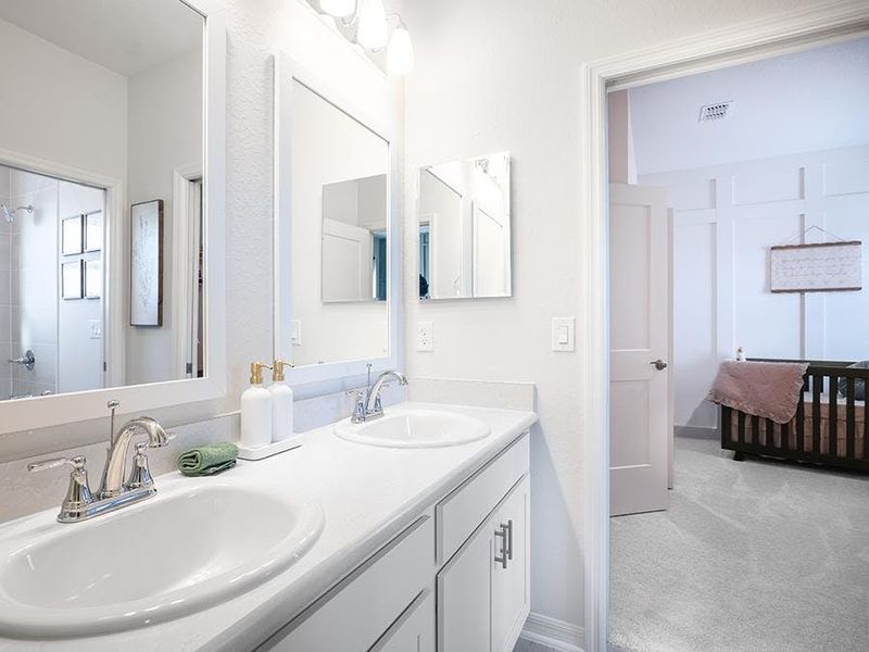 Secondary bedrooms share a Jack-and-Jill bath - Shelby II by Highland Homes