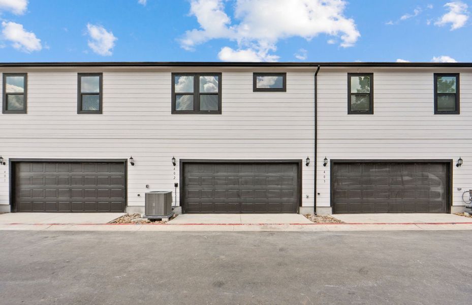 Front exterior of a new home in Monarch on Main, Round Rock, TX, highlighting curb appeal (Image 20). Front exterior of a new home in Monarch on Main, Round Rock, TX, highlighting curb appeal (Image 20).