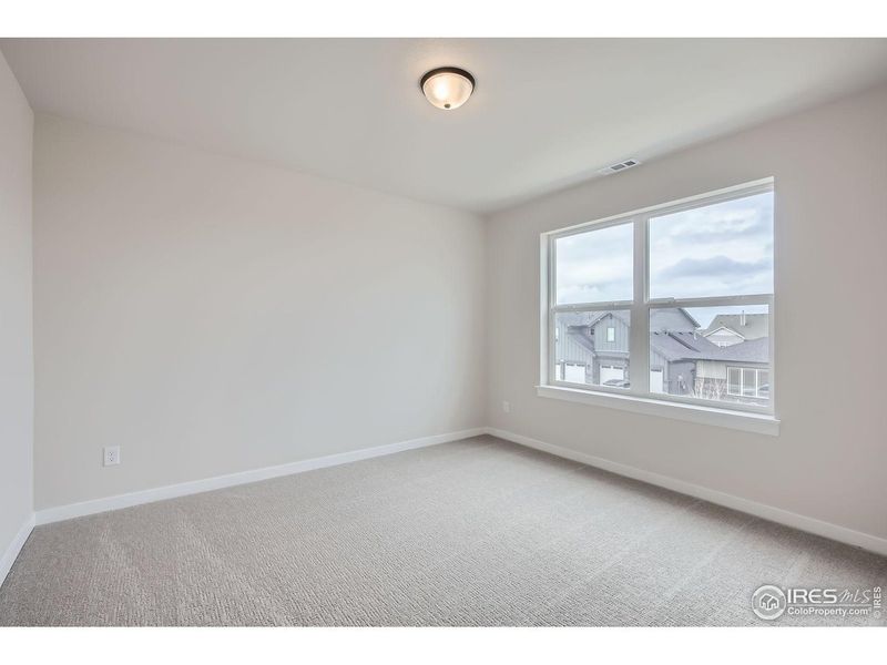 Spacious, unfurnished interior of a new home in RainDance, Windsor (Image 21).