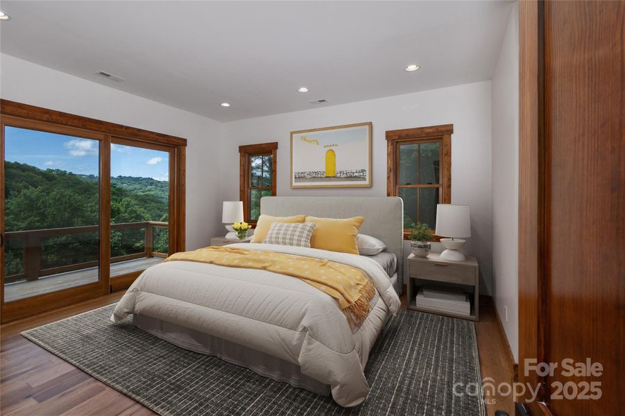 Main floor primary suite with incredible mountain views, access to porch & 2 walk-in closets. Primary bathroom with double vanities & backlit mirrors, soaking bathtub, shower & water closet.