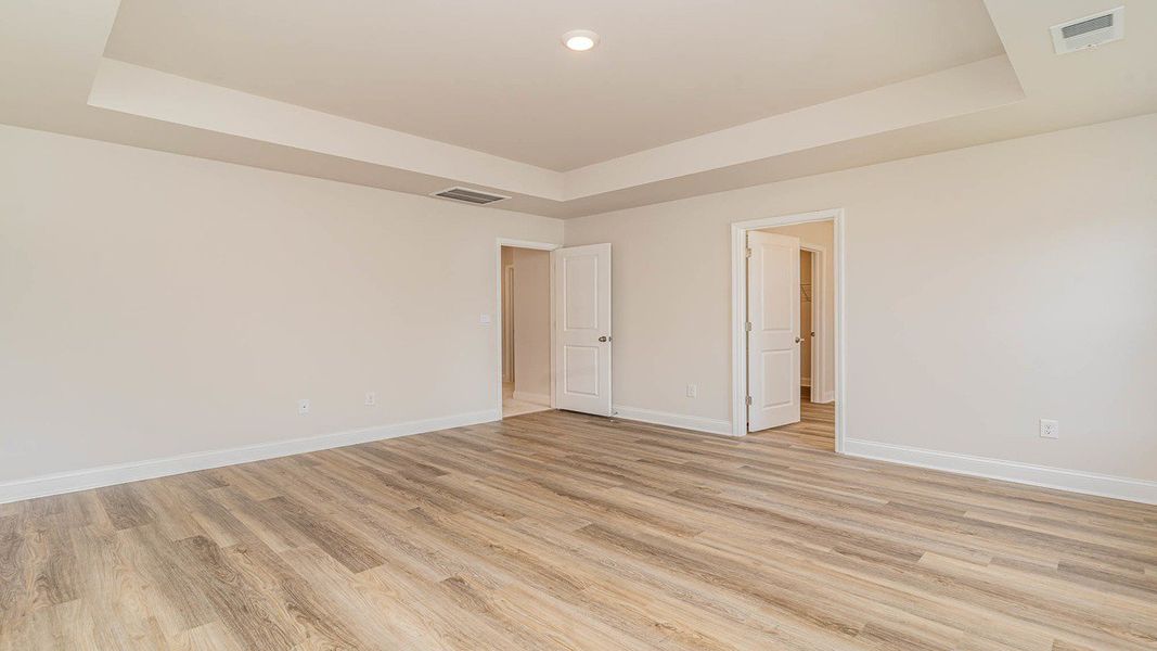 Representative unfurnished interior of a home built from the Forrester by D.R. Horton in Lake Tide Summit, Chapin (Image 17).