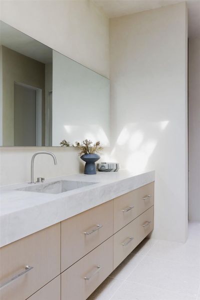 Bathroom featuring vanity and light tile patterned floors