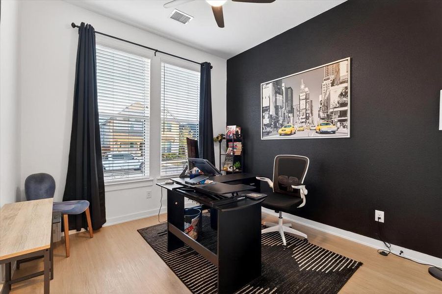 Office featuring ceiling fan and light wood-style floors Office featuring ceiling fan and light wood-style floors
