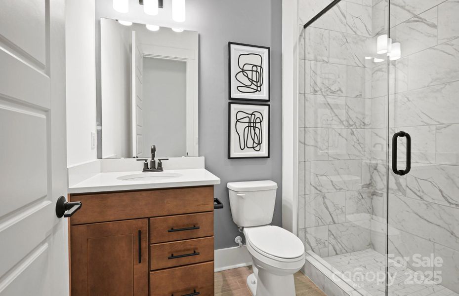 First Floor Full Bath with Walk-in Shower.  Representative Photo