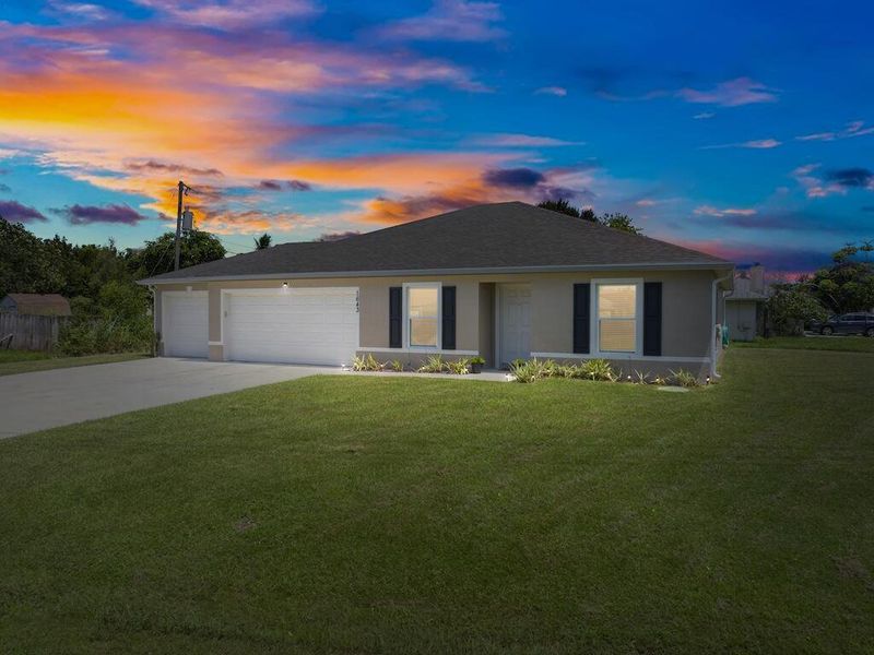 Front exterior of a new home in , Port St. Lucie, FL, highlighting curb appeal (Image 2).