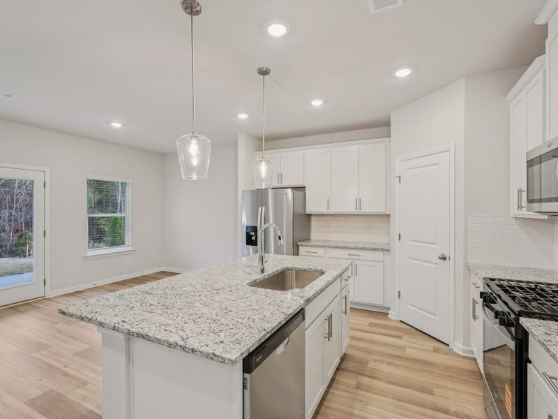 Furnished interior view inside a new home in Vines at Mill Creek - Estate Series, Braselton (Image 8).