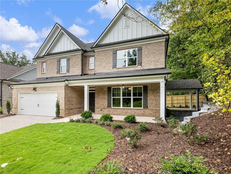 Front exterior of a new home in , Buford, GA, highlighting curb appeal (Image 23). Front exterior of a new home in , Buford, GA, highlighting curb appeal (Image 23).
