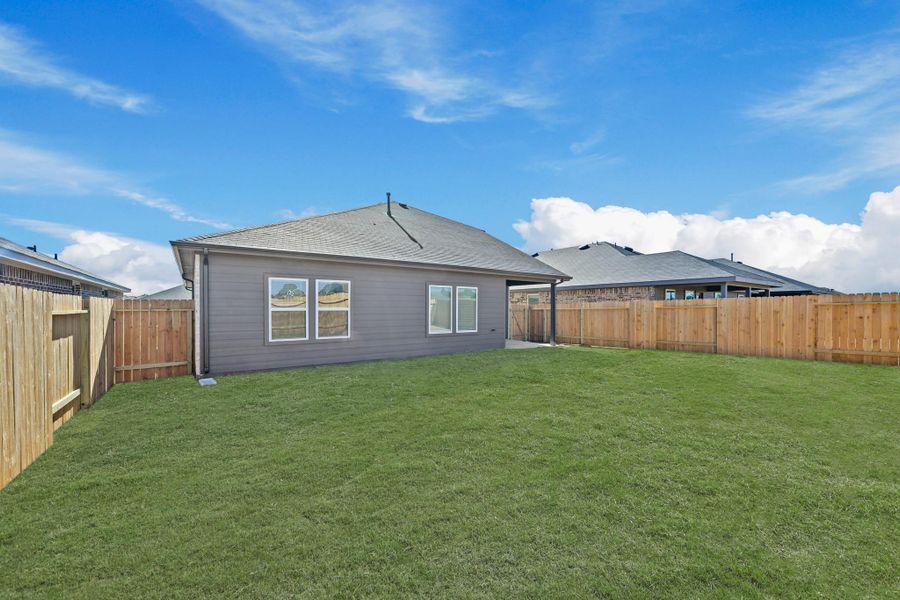 Exterior details and patio area of a home in Porters Mill, New Caney (Image 16).