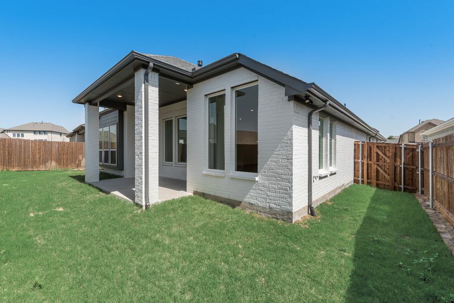 Exterior details and patio area of a home in Tavolo Park, Fort Worth (Image 4).