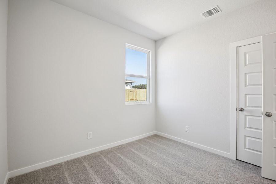 A room with a window and a door. A room with a window and a door.