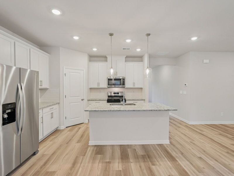 Furnished interior view inside a new home in Vines at Mill Creek - Estate Series, Braselton (Image 5).