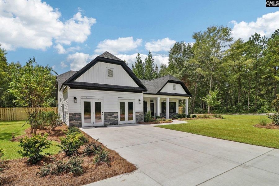 Front exterior of a new home in Raglins Creek, Lugoff, SC, highlighting curb appeal (Image 21).