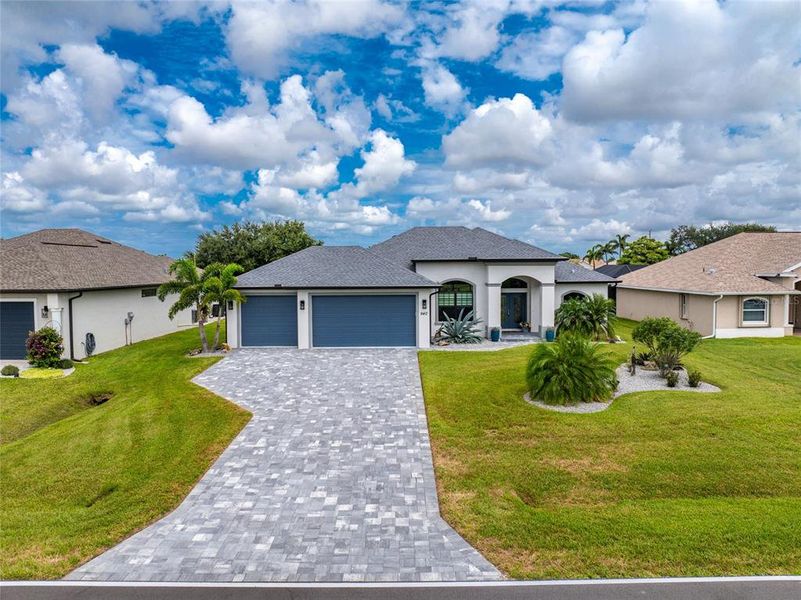 Front exterior of a new home in , Rotonda West, FL, highlighting curb appeal (Image 25).