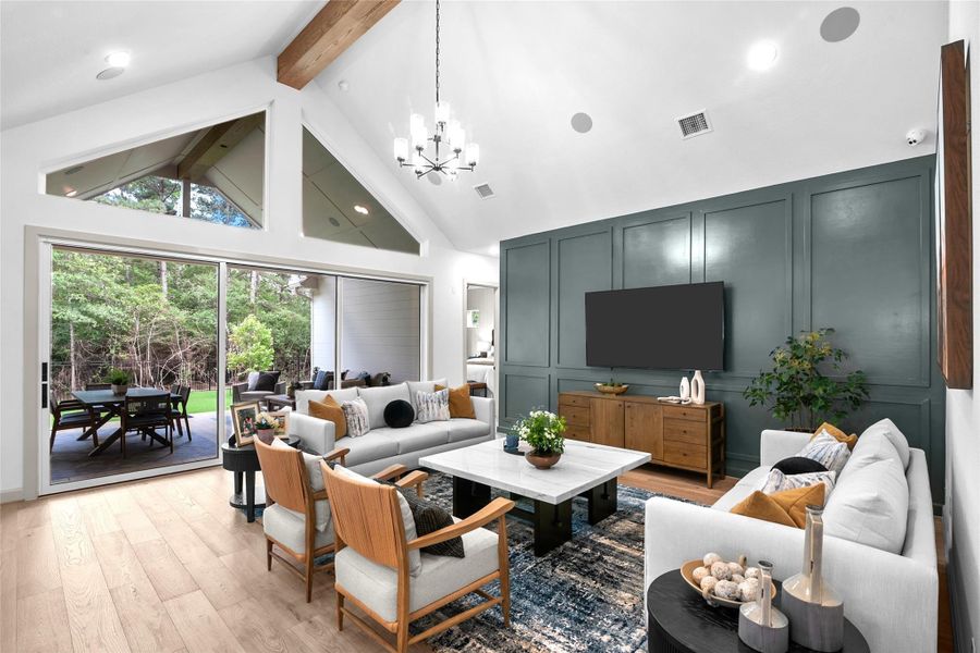 REPRESENTATIVE PHOTO: Large Living with cathedral ceiling, trapezoid windows over stacking sliding glass doors that brings the outside in! Beam optional.