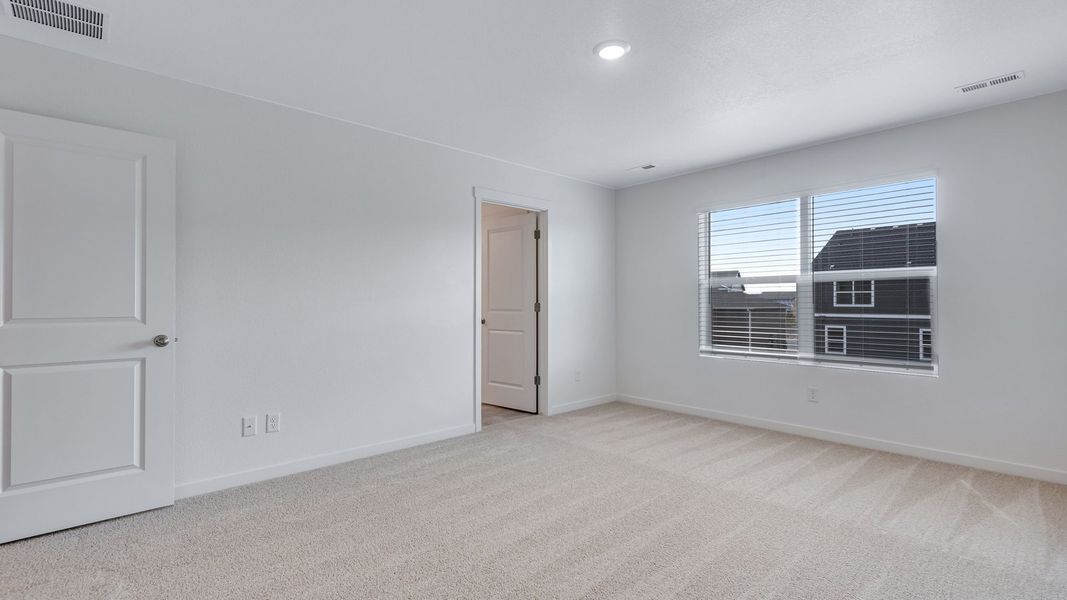 Spacious, unfurnished interior of a new home in Trails at Crowfoot, Parker (Image 20).