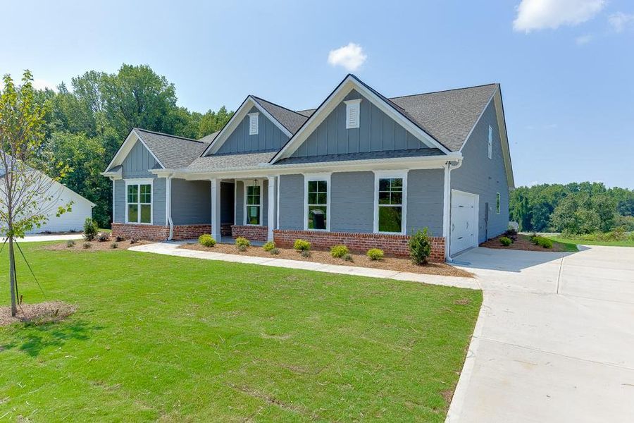 Front exterior of a new home in , Jefferson, GA, highlighting curb appeal (Image 20).