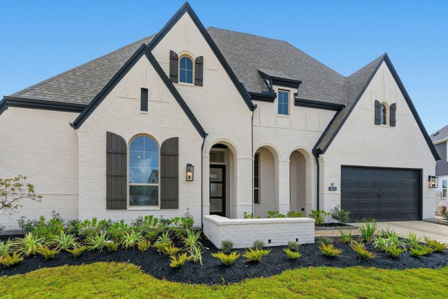 Front exterior of a new home in , Cypress, TX, highlighting curb appeal (Image 1).